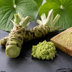 Friss wasabi gyöktörzs és reszelt wasabi paszta közeli prémium fotón